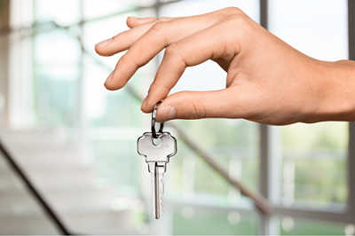 small-business-attorney-hand-with-key-to-a-small-business small business attorney, hand with key to a small business