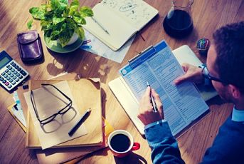 small-business-attorney-reviewing-documents small business attorney reviewing documents